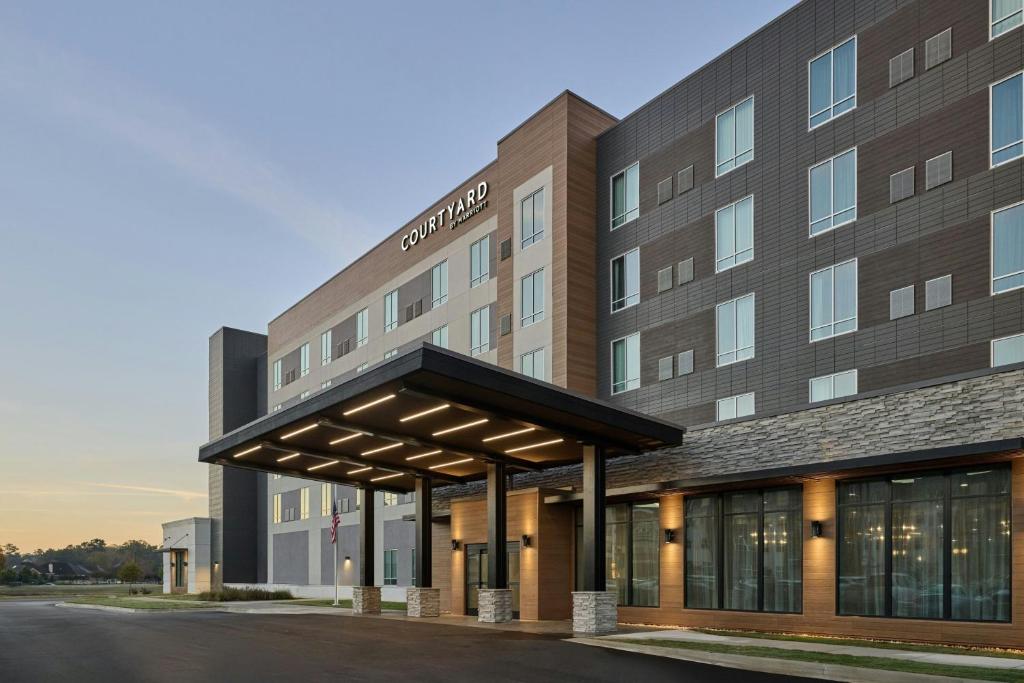 a rendering of the exterior of a hotel at Courtyard by Marriott Madison in Madison