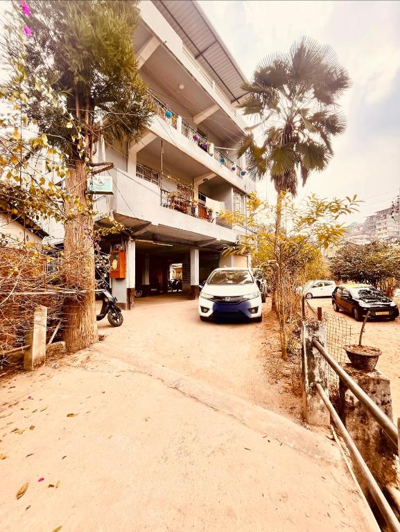 a car parked in front of a building at Kusum Nest in Shillong