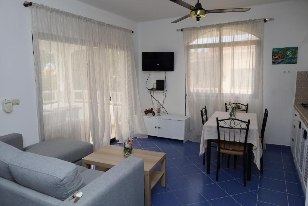 a living room with a couch and a table at Venus Bayahibe by Mireya in Bayahibe