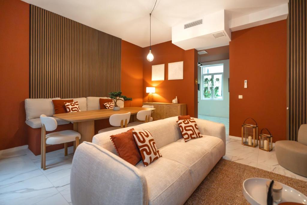 a living room with a couch and a table at Vandenbranden Suites in Brussels