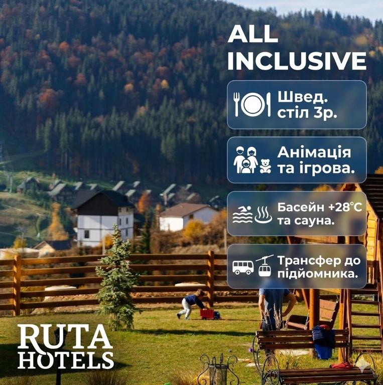 a group of signs in a field with a mountain at RUTA resort Polianytsia ALL INLCUSIVE in Bukovel