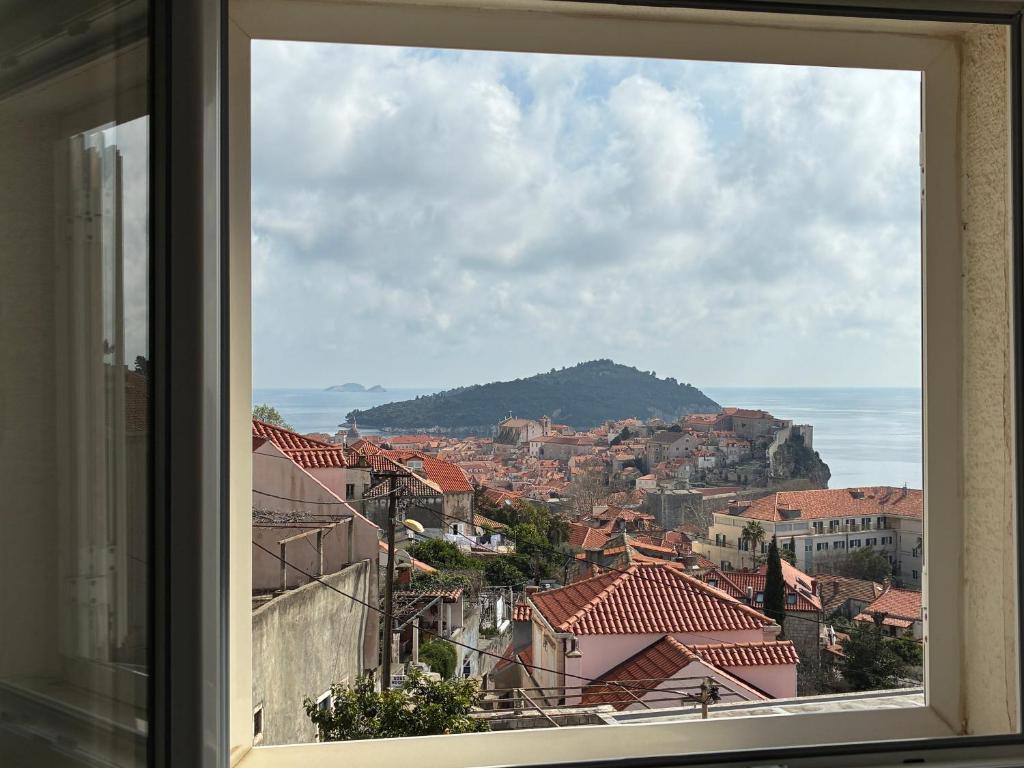 a view of a city from a window at guesthouse Libertas 3 in Dubrovnik