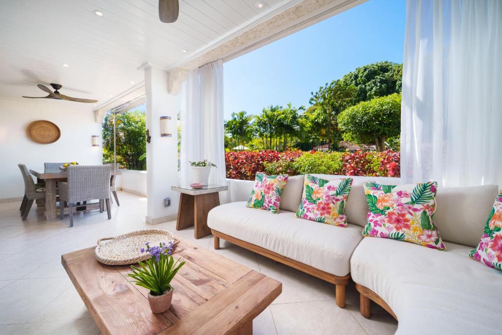 a living room with a couch and a table at Glitter Bay Apartment 104 in Saint James
