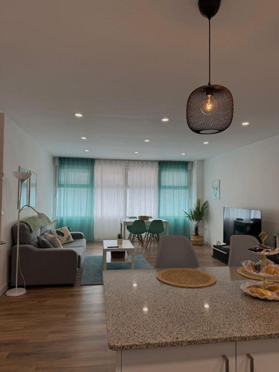a living room with a couch and a table at Bruma in Vilagarcia de Arousa