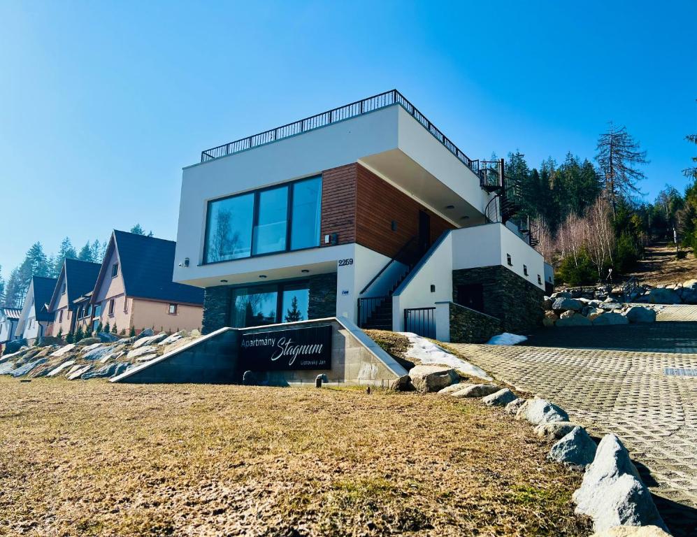 a house on the side of a hill at Apartmány Stagnum Liptovský Ján in Liptovský Ján