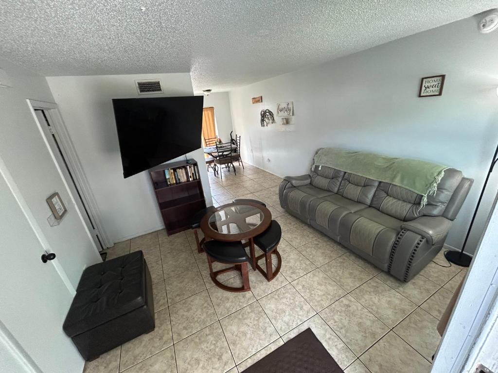 a living room with a couch and a table at Plum Cozy Spot in Seffner