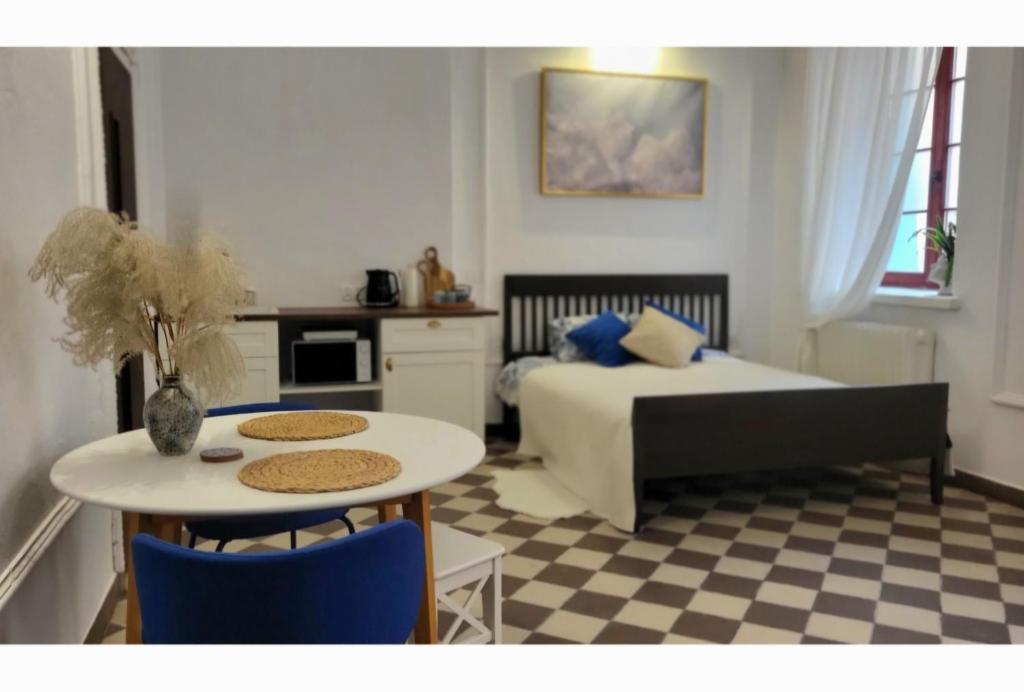 a bedroom with a bed and a table and chairs at Niebo in Lublin