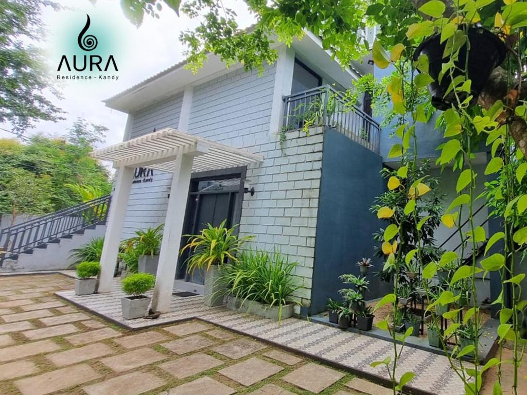 a villa with a view of the front of the house at Aura Residence-Kandy in Katugastota
