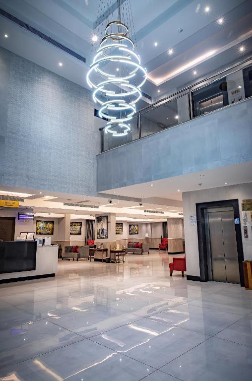 a large lobby with a large chandelier in a building at دار ود للشقق المخدومة Dar Wed in Jeddah