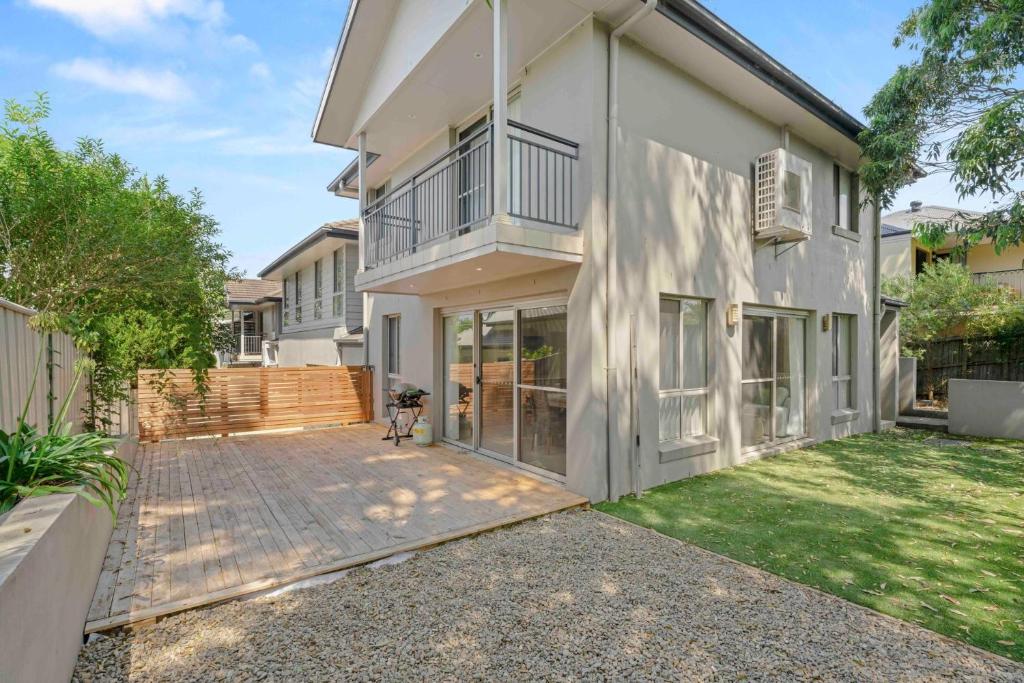 an exterior view of a house with a patio at Manning the Waves in Kiama