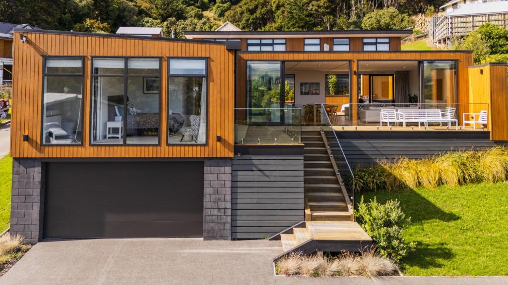 a modern house with a large glass door at Renard Retreat in Akaroa
