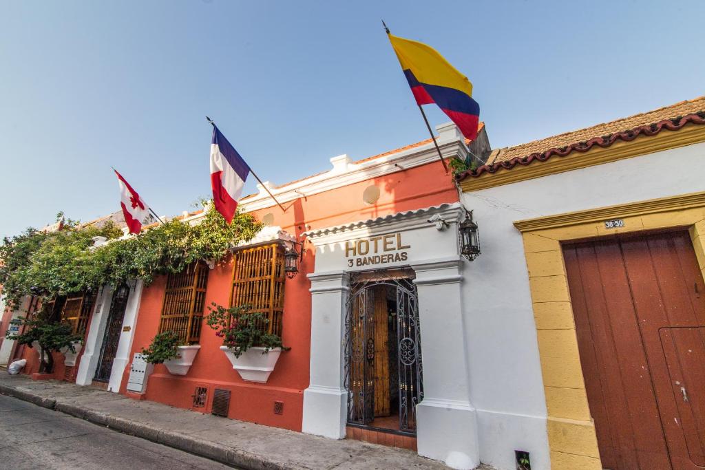 a building with a flag on the front of it at Hotel 3 Banderas in Cartagena de Indias