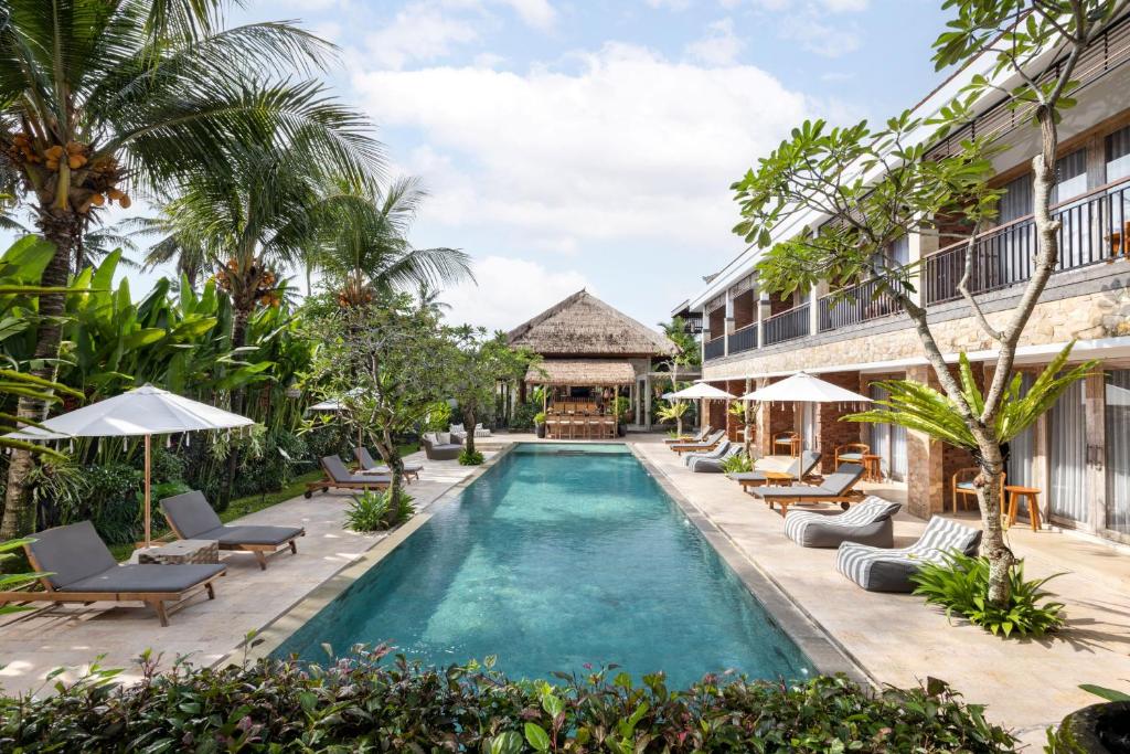 an image of a swimming pool at a resort at Kahayana Suites Ubud in Ubud