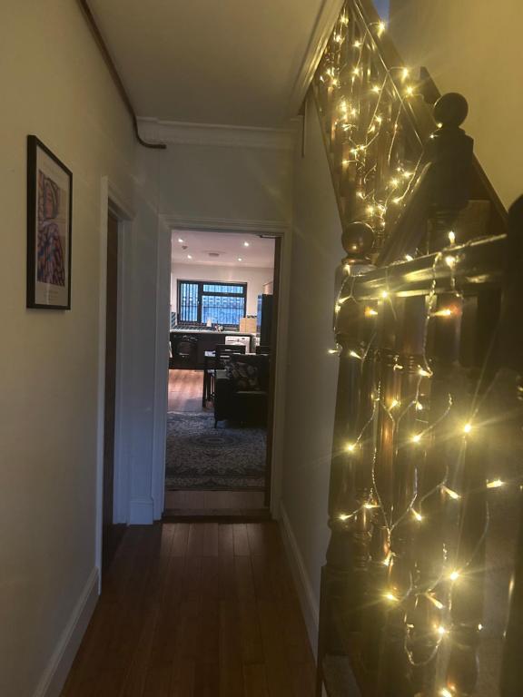 a hallway with christmas lights on a wall at The Phoenix in Swansea