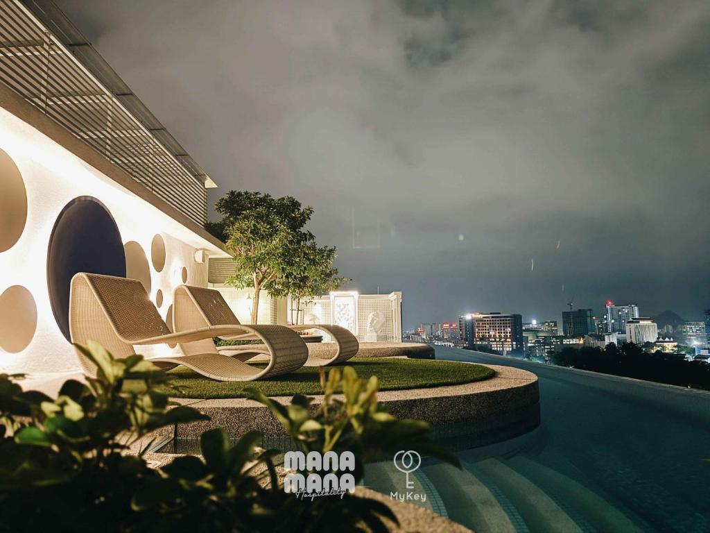 a group of chairs sitting on the side of a building at Stallionz by MyKey in Ipoh