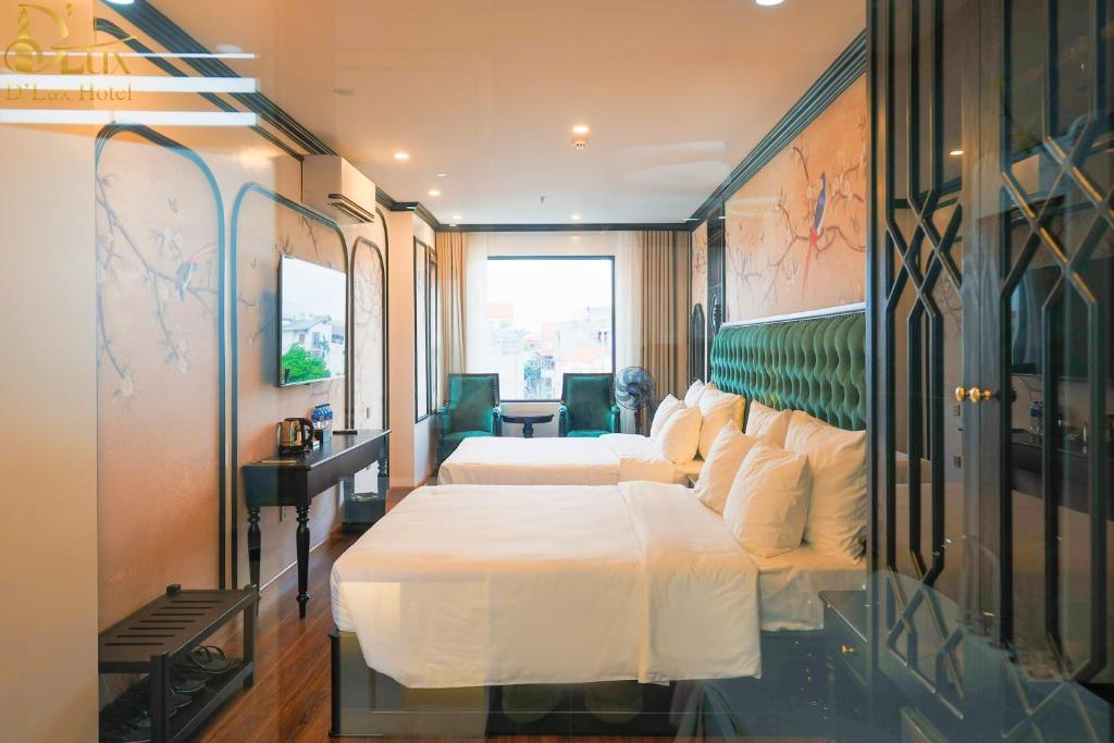 a hotel room with a large bed and a window at D'Lux Hotel in Hanoi