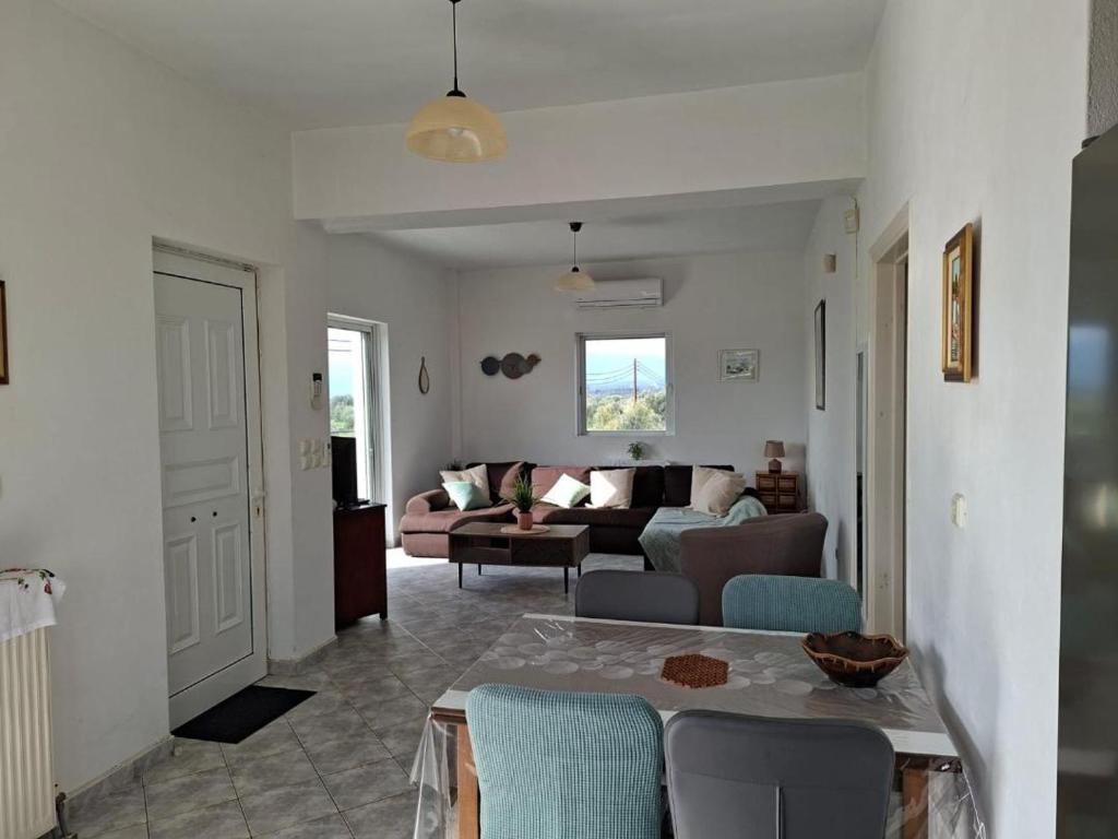 a living room with a couch and a table at APARTMENT Sonia in Análipsis