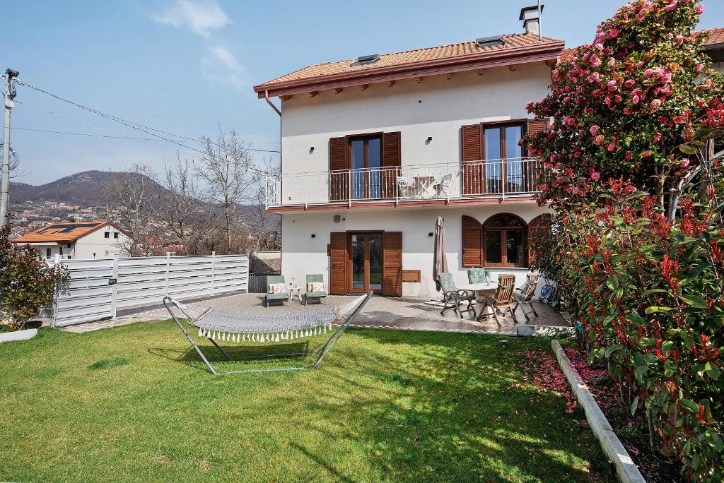a house with a yard with chairs and a fence at Principe Di Agerola in Agerola