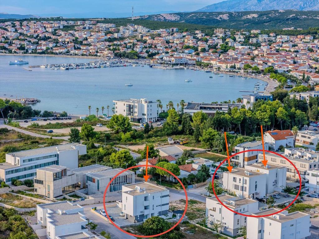 an aerial view of a city with a body of water at Apartments Olive Gardens 2 in Novalja