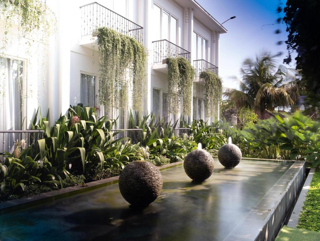 a rendering of the front of a building with plants at Umpadhi Canggu in Canggu