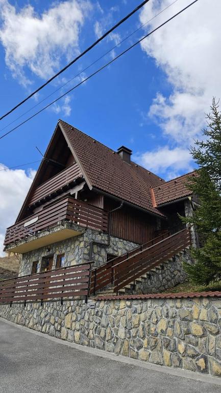 a house on top of a stone wall at Kuća za odmor Vesna in Stari Laz