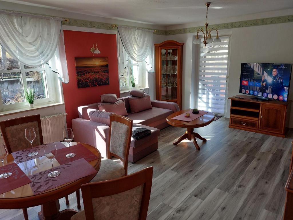 a living room with a couch and a table at Apartment Erzgebirgsperle in Schwarzenberg