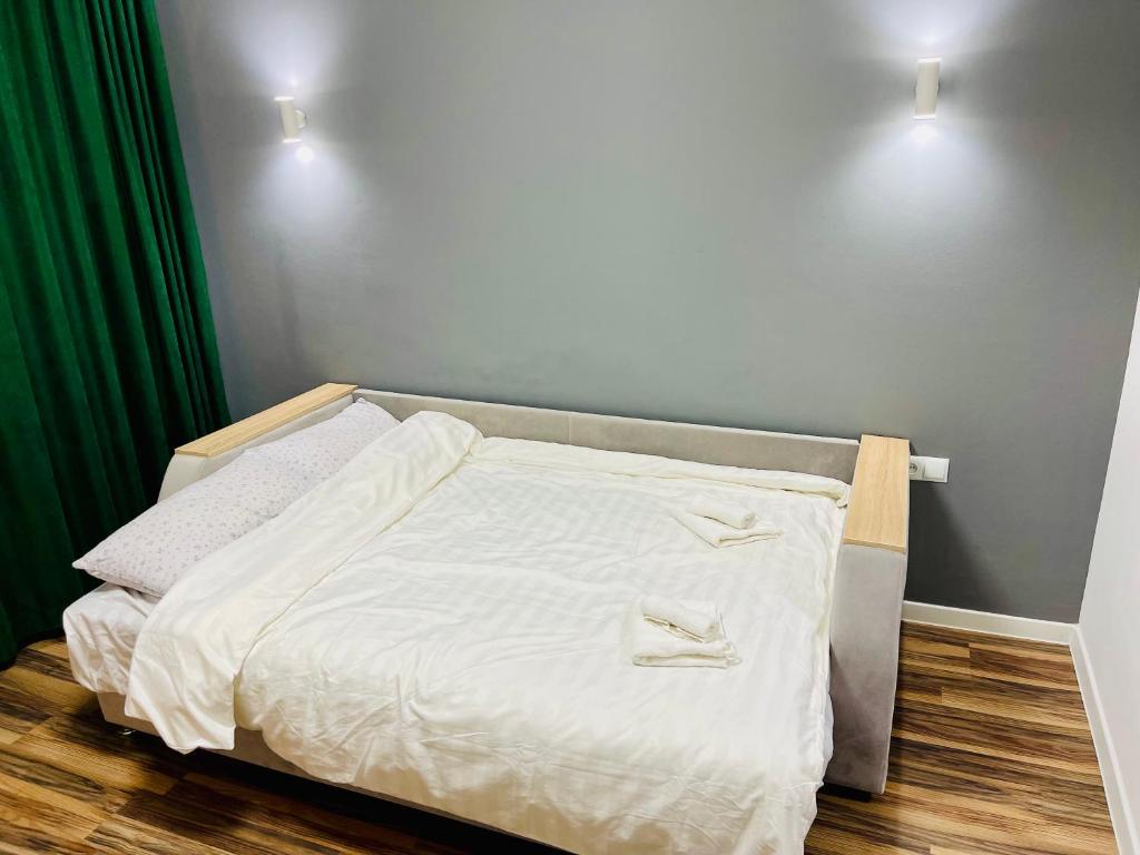 En eller flere senge i et værelse på Studio Room Chisinau