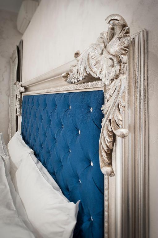 Uma cama ou camas num quarto em Arena Easy Suites Guesthouse
