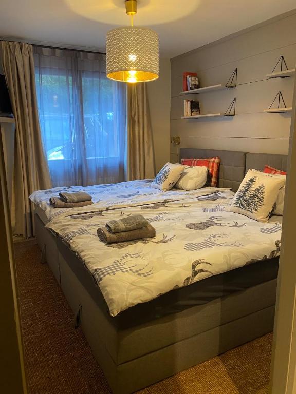 a bedroom with a bed with two pillows on it at Cosy Residence, The Verbier Residences in Verbier