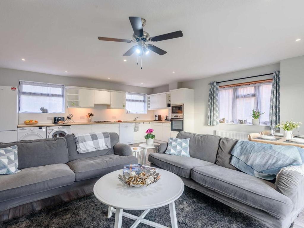 a living room with a couch and a table at 2 Bed in Northwich oc-85877 in Kingsley