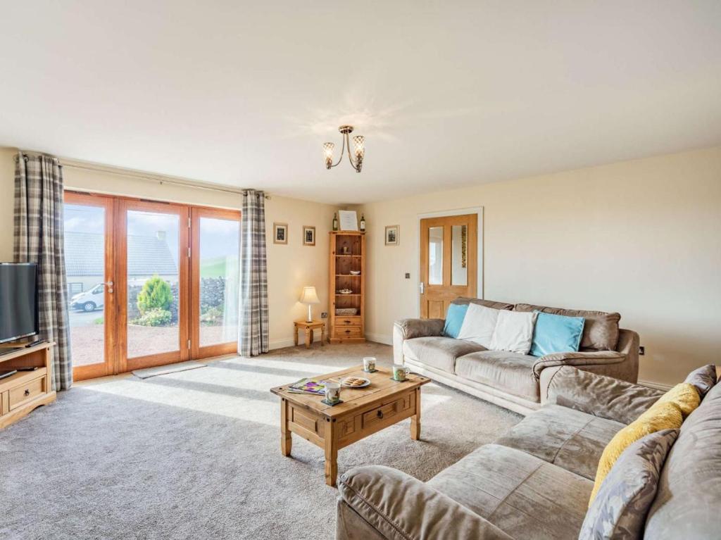 a living room with a couch and a table at 3 Bed in Berwick-upon-tweed oc-87777 in Lamberton