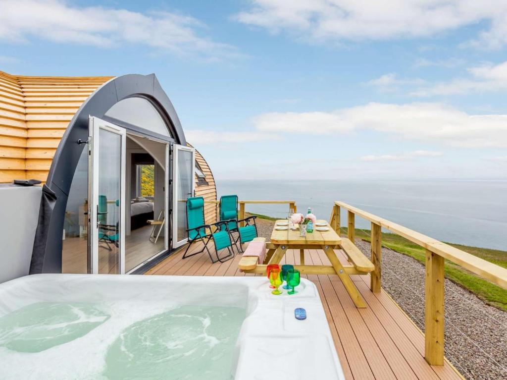 a hot tub on the deck of a house at 2 Bed in Tain oc-81340 in Nigg