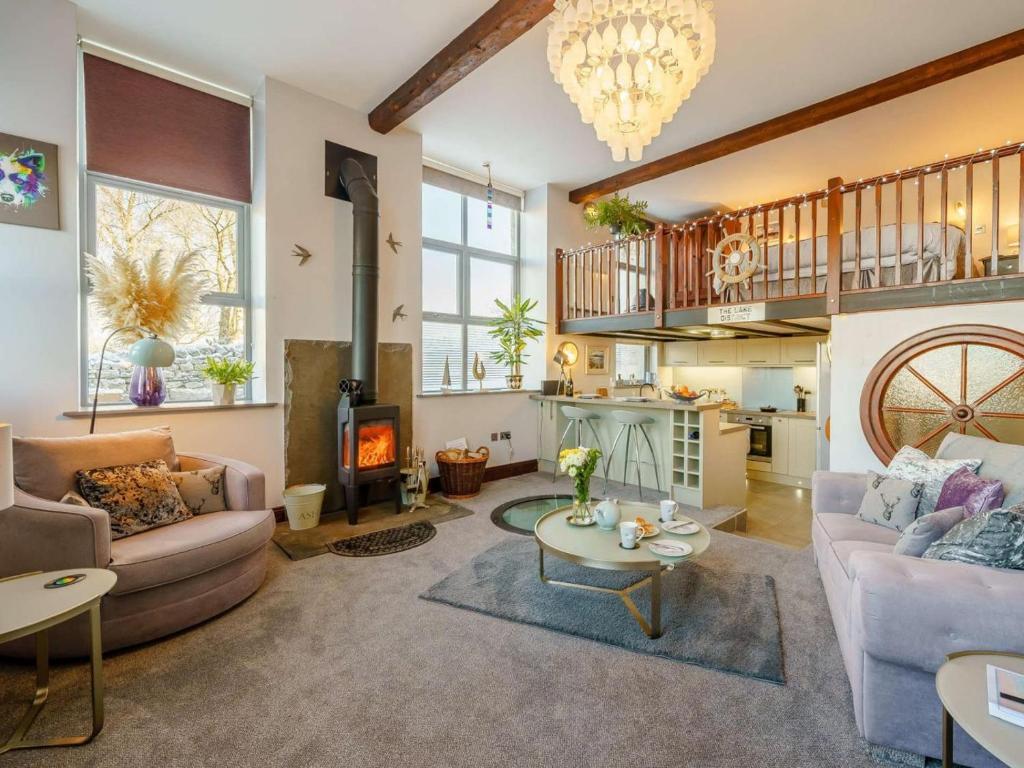 a living room with a couch and a fireplace at 1 Bed in Carnforth oc-90528 in Beetham