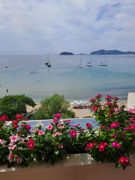 a view of the ocean with boats in the water at CRYSTAL BAY in Paleo Tsifliki