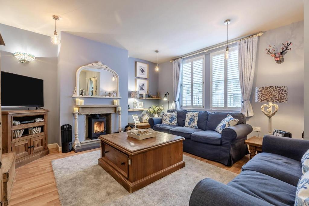 a living room with a couch and a fireplace at 2 Bed in Bakewell oc-t34225 in Bakewell