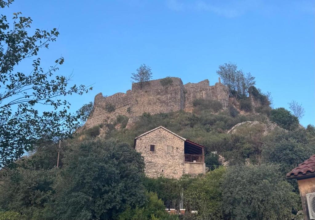 an old building on the side of a mountain at Skadar Lake Stone House in Podgorica