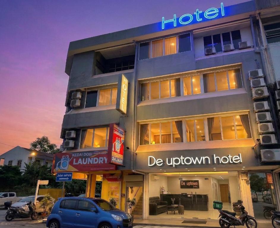 a hotel with a blue car parked in front of it at De UPTOWN Hotel @ P.J. 222 in Petaling Jaya