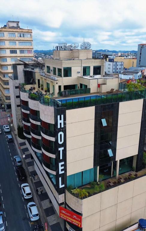 an aerial view of a building in a city at Master Plaza Hotel in Barbacena