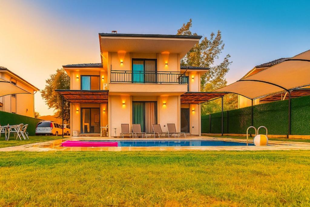 a house with a swimming pool in the yard at Holiday Villa Lena in Köyceğiz