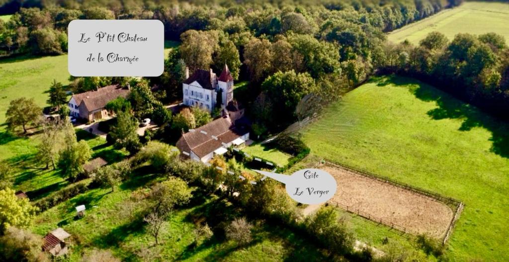 an aerial view of a house in a field at Le Verger in La Charmée