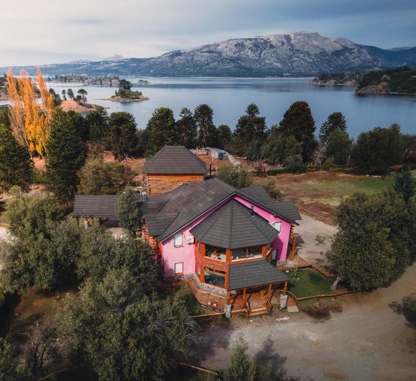 an aerial view of a house on a lake at Nuevo Puerto Malen in Villa Pehuenia
