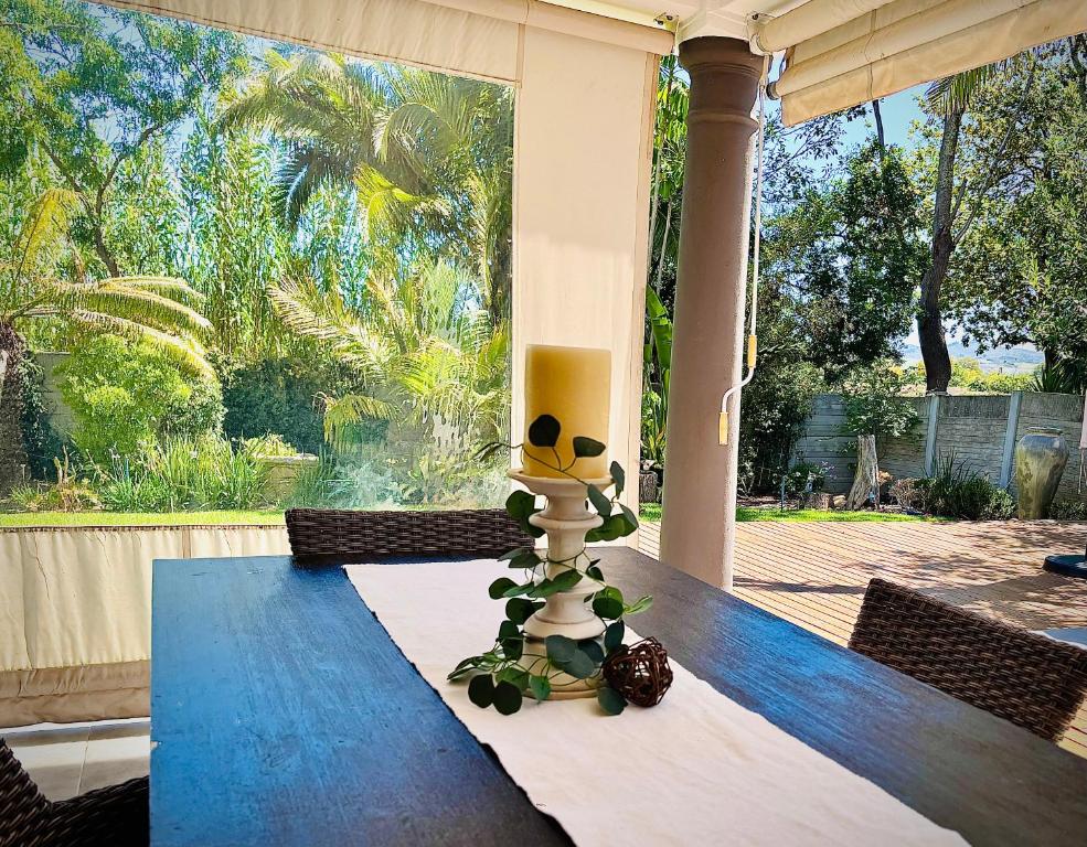 a table with a stuffed animal sitting on top of it at Klein Geluk Cottage in Stellenbosch