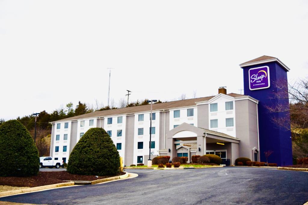 a front view of a hotel with a parking lot at Sleep Inn Staunton in Staunton