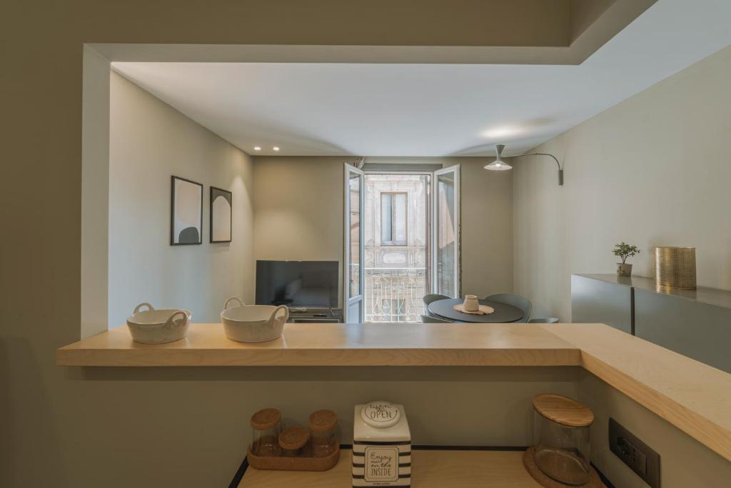 a kitchen with a counter with bowls on it at Torrearsa street 35 in Trapani
