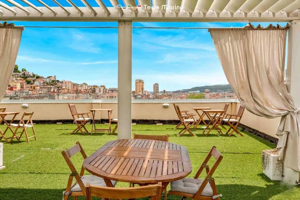 a table and chairs on a balcony with a view at Italian House Cinque Terre, Terre Marine in La Spezia