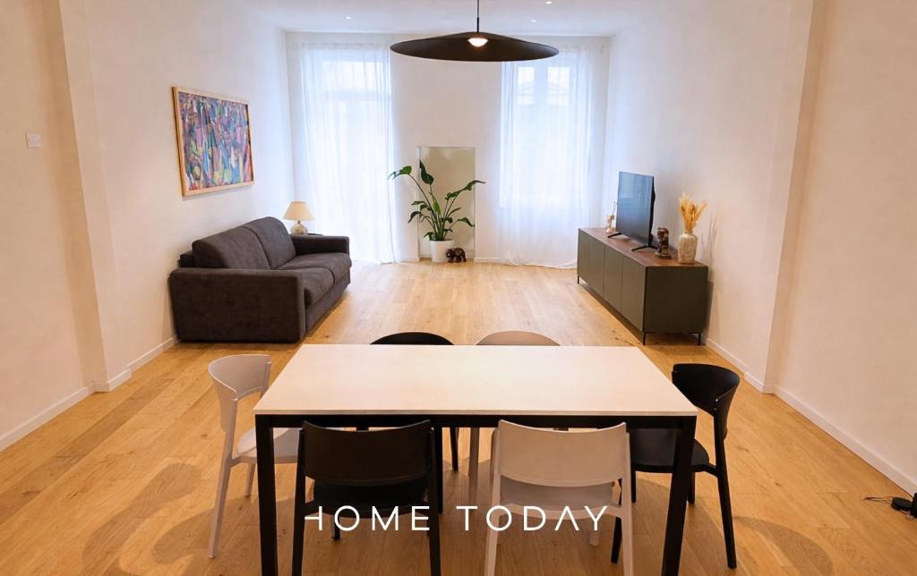 a living room with a table and a couch at HT - Basilica View Luxury Loft in Padova