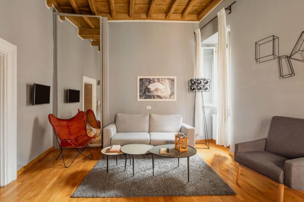 a living room with a couch and a table at Campo de Fiori Bright Apartment in Rome