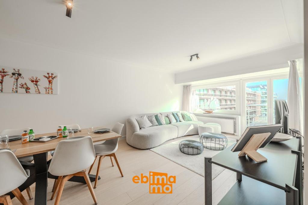 a living room with a couch and a table at Velasquez 0303 in Nieuwpoort