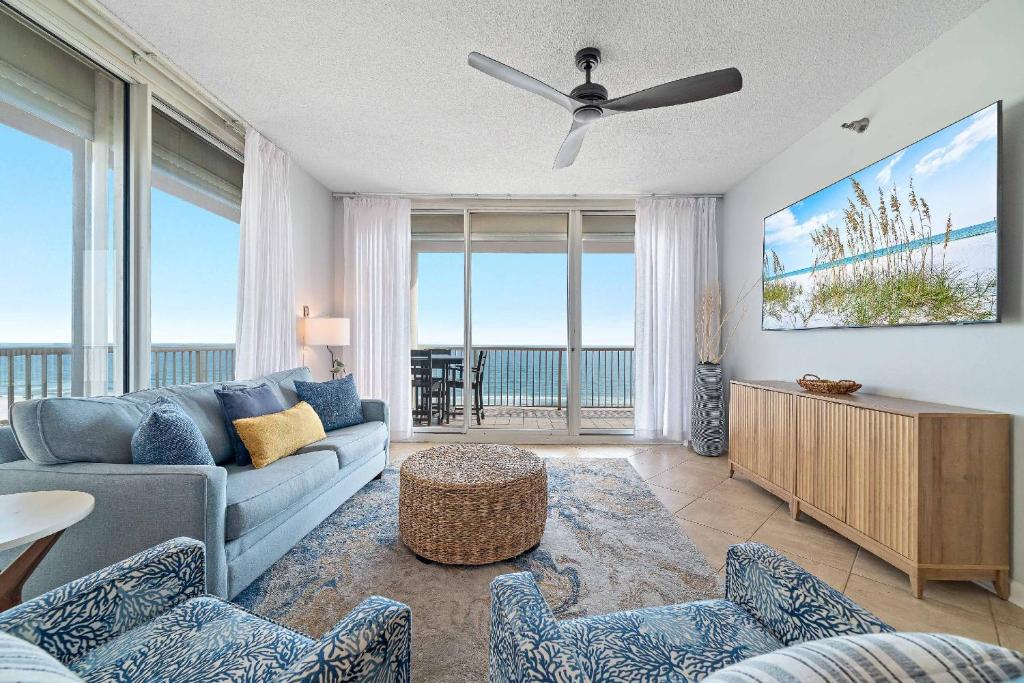 a living room with a couch and a tv at Beach Club D-801 in Gulf Highlands