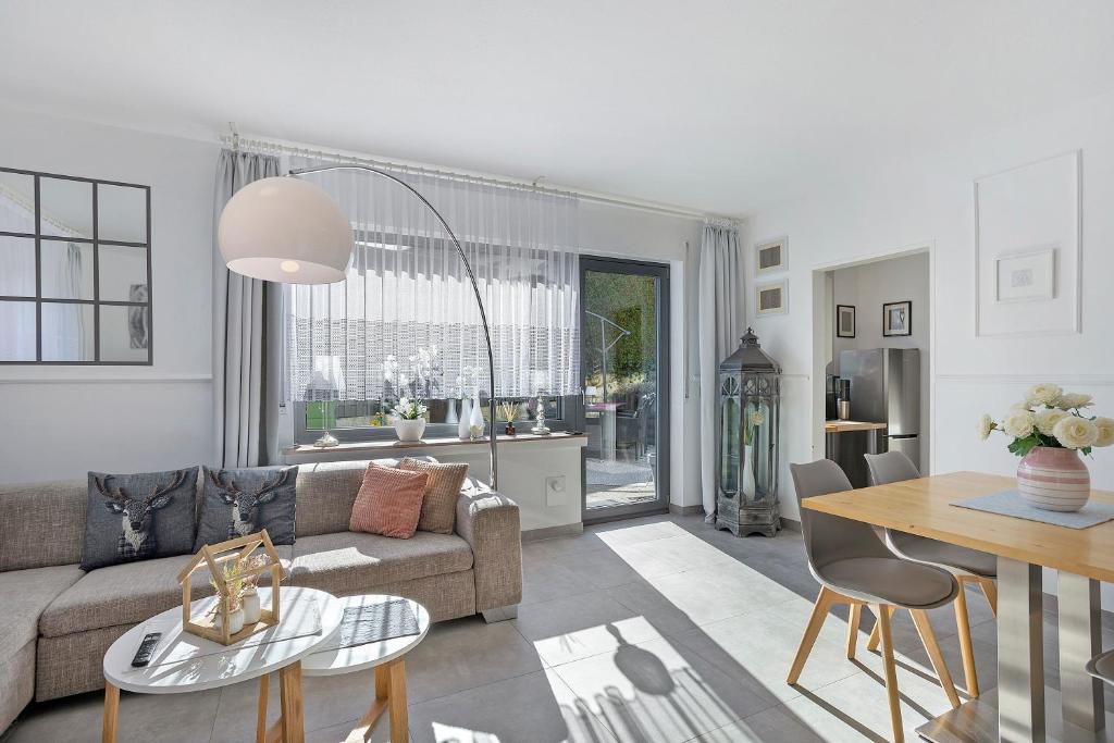 a living room with a couch and a table at Ferienwohnung Riekes in Schmallenberg